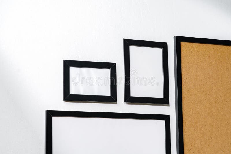 Set of Black Frames on White Wall with Copy Space Stock Photo Image