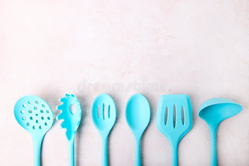 Set of Blue Kitchen Utensils in a Ceramic Cup and Tableware Stock Photo