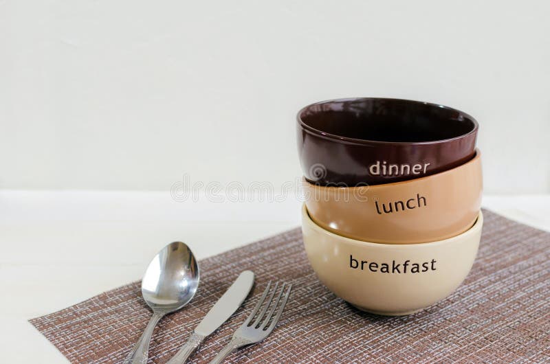 Set of bowls. Written breakfast, lunch, dinner