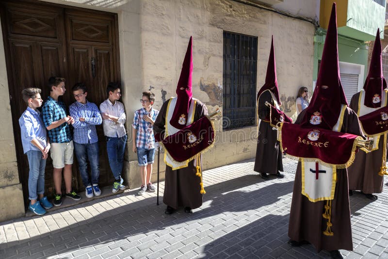 Set of boys watching Holy week procession, Spain, take in Linare stock photos Set of boys watching Holy week procession, Spain, take in Linare stock photos