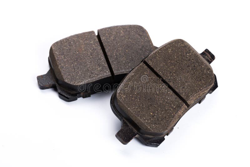 Set of brake pads, car spares isolated on white background stock image Set of brake pads, car spares isolated on white background stock image