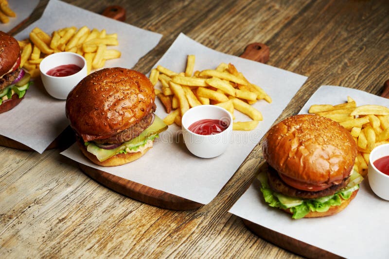 Set Of Burgers With French Fries And Ketchup Sauce Stock Photo Image