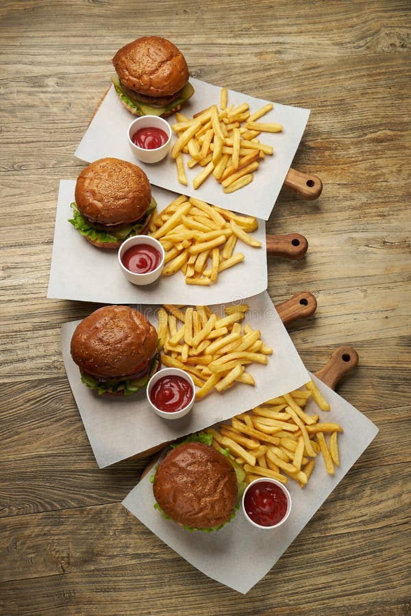 Set Of Burgers With French Fries And Ketchup Sauce Stock Photo Image