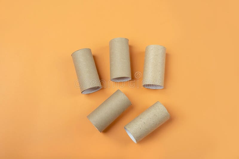 Set of bushings from toilet roll tube on orange background. DIY and kids Halloween creativity.Children Craft. Eco-friendly reuse recycle