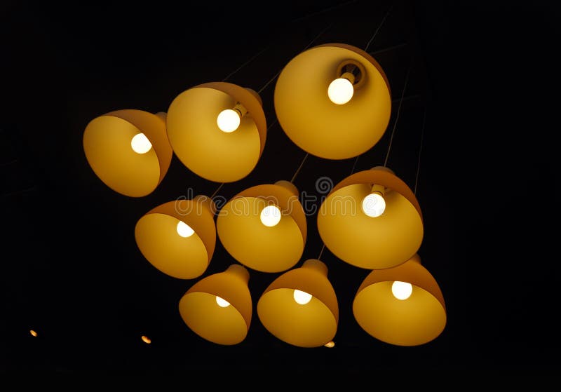 Set of ceiling lamps hanging on long cords royalty free stock image