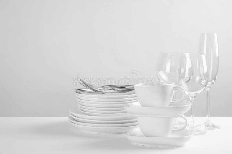 Set of clean dishes on table