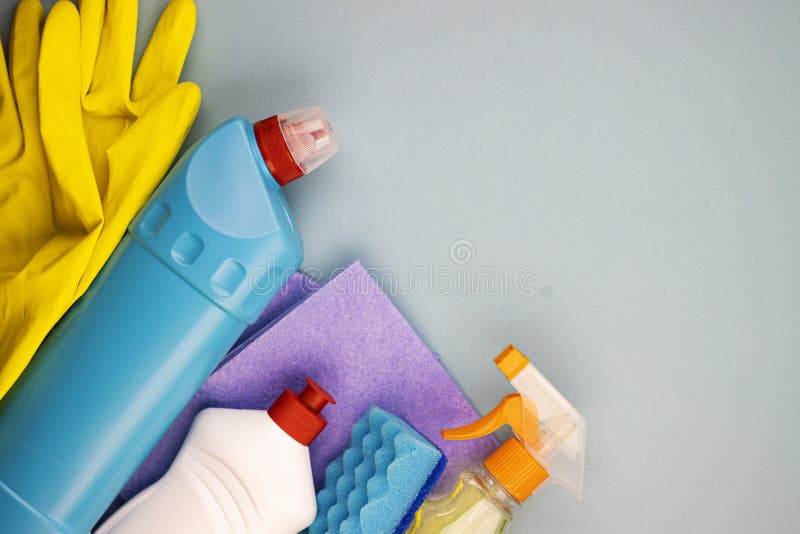 Home Office Apartment Cleaning Kit on Blue Background with Space