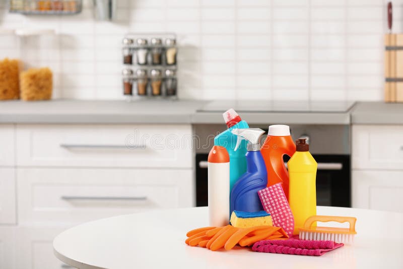 Set of Cleaning Supplies on Table in Kitchen. Stock Image Image of