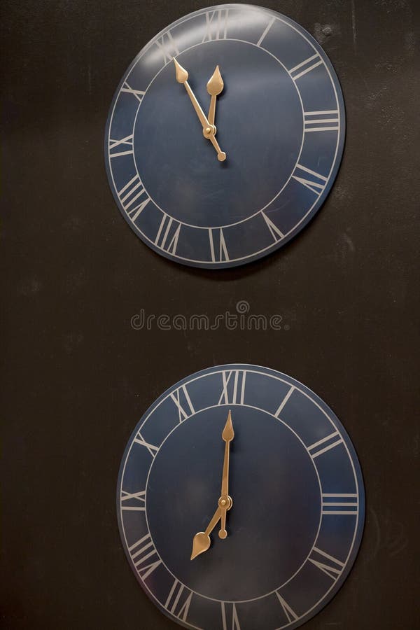 Many Different Wall Clock on the Wall .Set of Clockfaces . Concept of