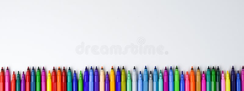Set of colored markers without caps on a white background with empty space to insert stock photography
