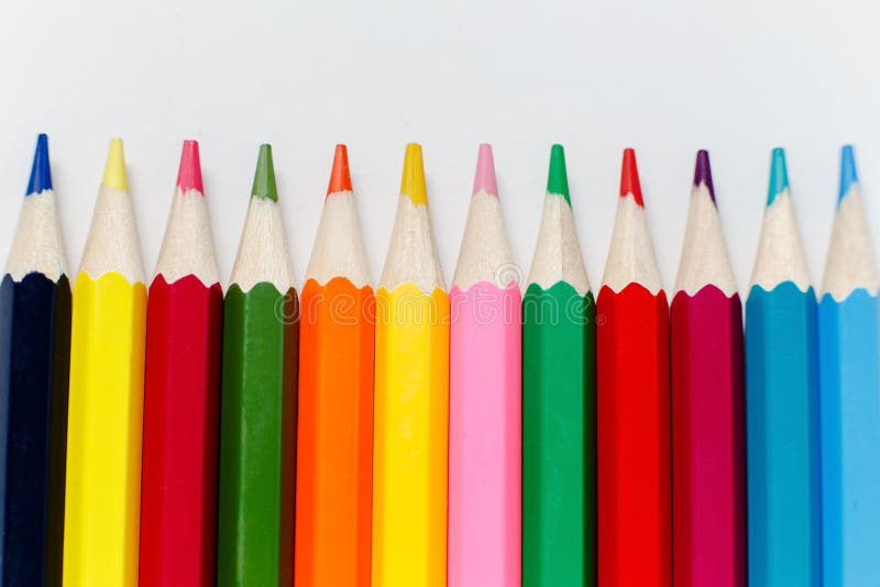 Team of Colored Pencils Lined with Rays on White Background Stock Photo ...