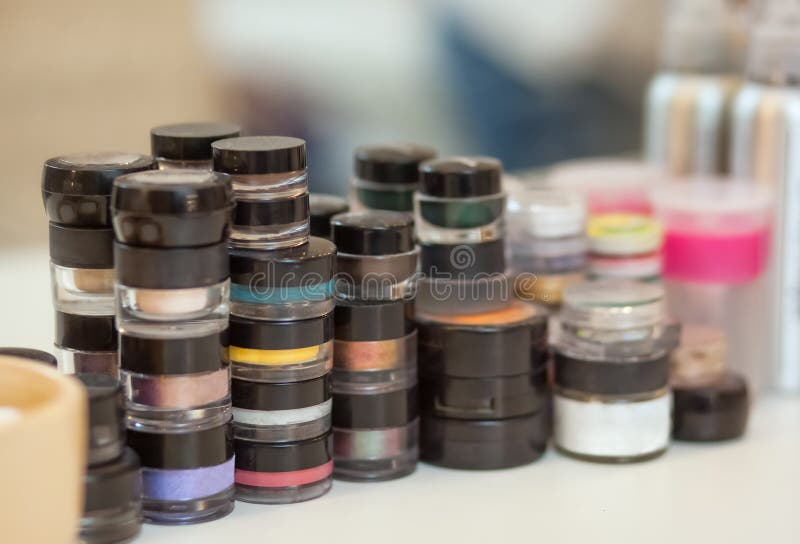 A set of cosmetic make-up stand on the table from the make-up artist in the beauty salon.