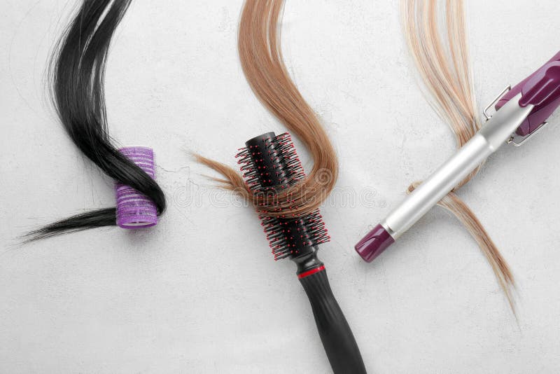 Set for curling hair on light textured background
