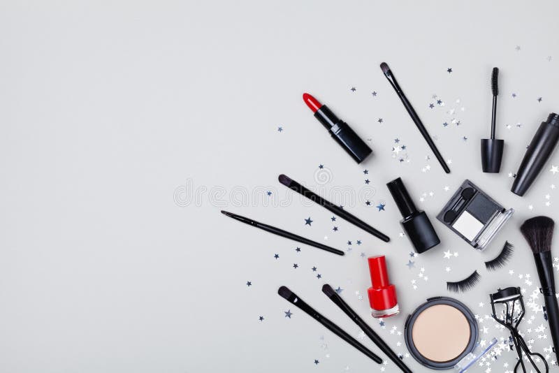 Set of decorative cosmetic and beauty products for makeup on star confetti background top view. Flat lay royalty free stock photos Set of decorative cosmetic and beauty products for makeup on star confetti background top view. Flat lay royalty free stock photos