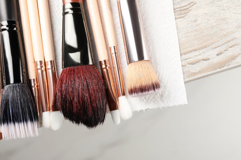 Set of Different Makeup Brushes Drying after Cleaning on Table, Closeup