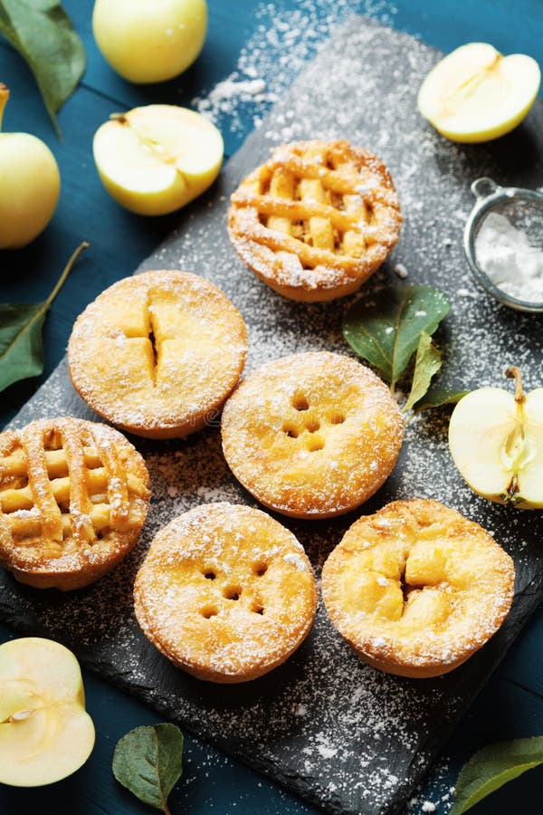 Set of different mini apple pies. Autumn pastry dessert.