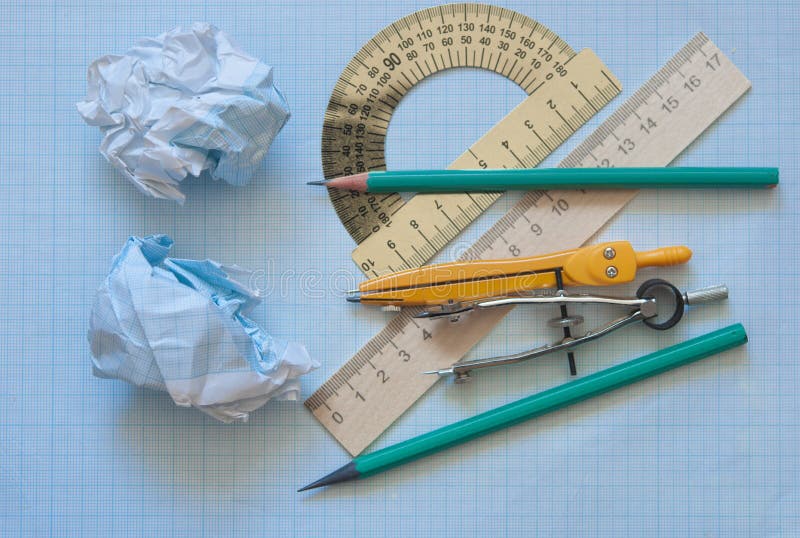 Set of drawing instrument and rulers on graph paper royalty free stock images