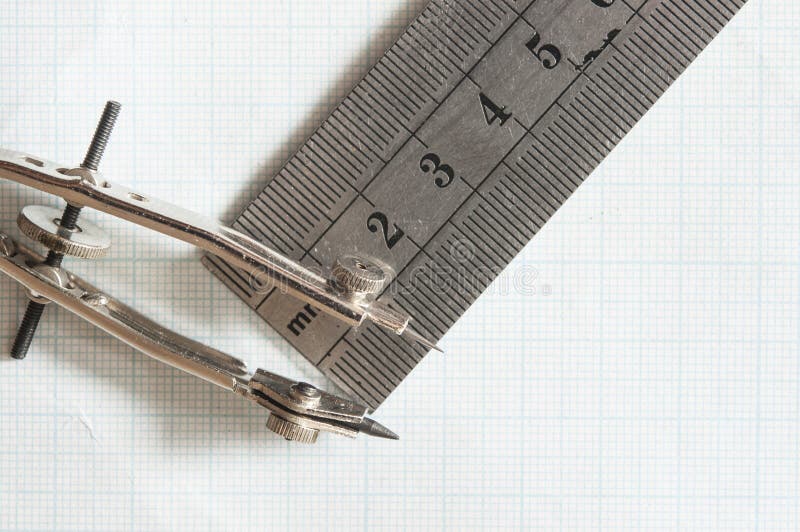 Set of drawing instrument and rulers on graph paper royalty free stock images