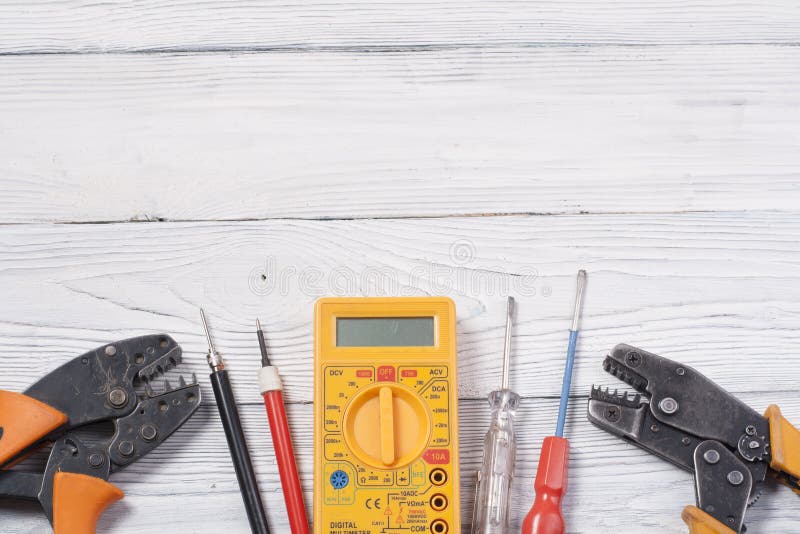 Set of Electrical Tool on Wooden Background. Accessories for Engineering Work, Energy Concept
