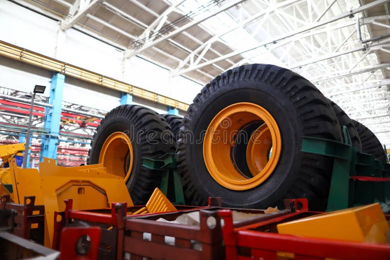 Set of Extremely Big Wheels Standing at Warehouse Stock Photo Image