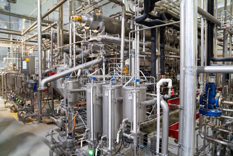 Set of facilities for cooking syrup, caramel at candy factory. production of sweets stock photos