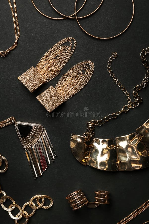 Set of Gold Jewelry on Black Background Stock Image Image of flat