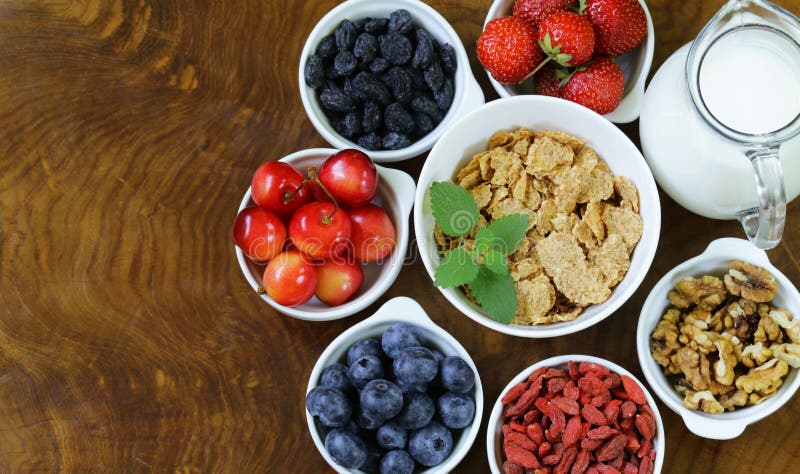 Set of ingredients for a healthy food breakfast - muesli, fresh and dried fruit, nuts, goji royalty free stock image Set of ingredients for a healthy food breakfast - muesli, fresh and dried fruit, nuts, goji royalty free stock image
