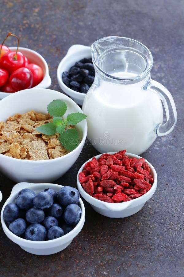 Set of ingredients for a healthy food breakfast - muesli, fresh and dried fruit, nuts, goji royalty free stock photo Set of ingredients for a healthy food breakfast - muesli, fresh and dried fruit, nuts, goji royalty free stock photo