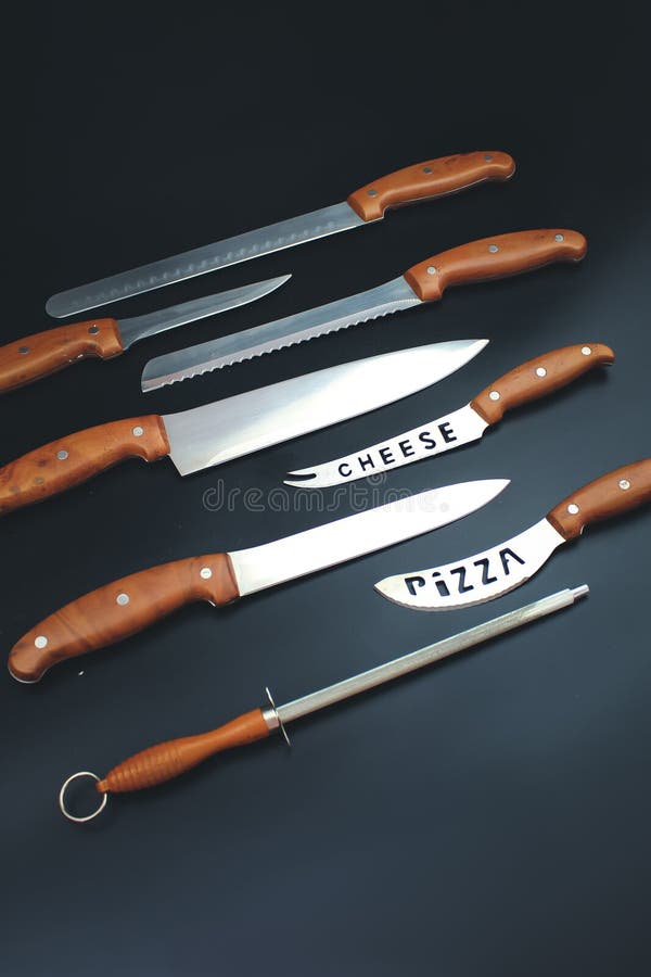 Set of Kitchen Knives on Grey Background. Quality Kitchen Knives Stock
