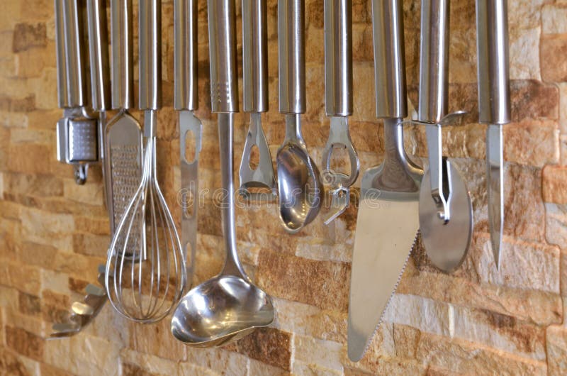 Set Of Kitchen Utensils Hanging On The Wall Stock Photo Image of fork