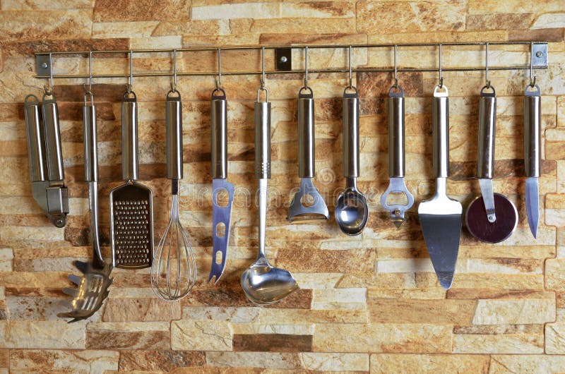 Set of Kitchen Utensils Hanging on the Wall Stock Photo Image of fork