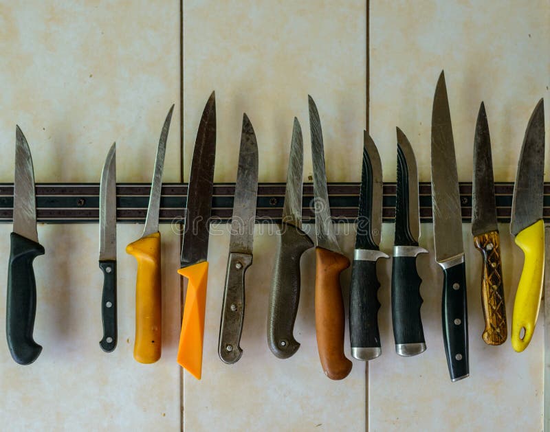 Set of knives at the wall stock photo. Image of sharp 232246300