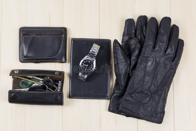 A set of leather goods, a bag, a key case, a document cover, a wallet purse, gloves, a watch. A set of leather goods, a bag, a key case, a document cover, a wallet purse, gloves, a watch