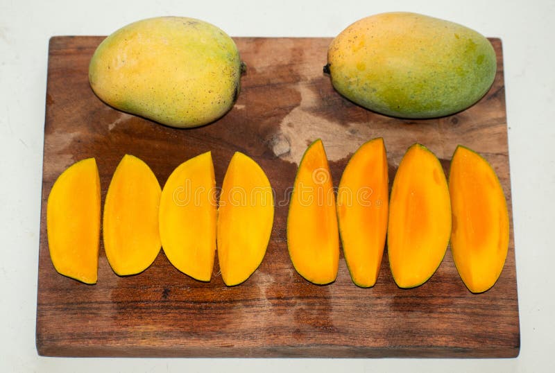 Set of mango fruits and mango slices royalty free stock image