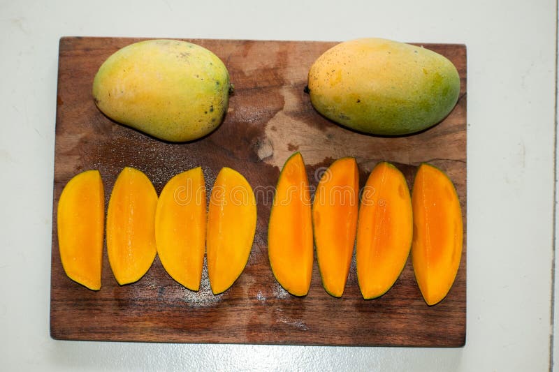 Set of mango fruits and mango slices royalty free stock images
