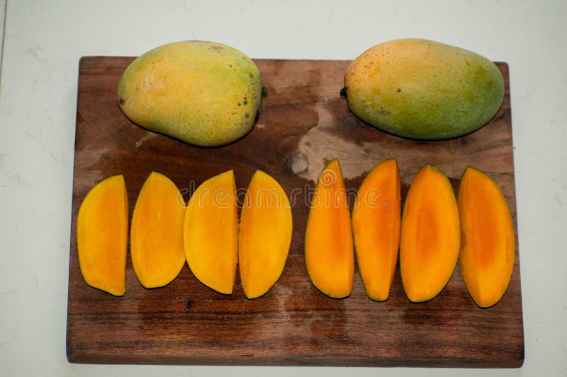 Set of mango fruits and mango slices royalty free stock photo