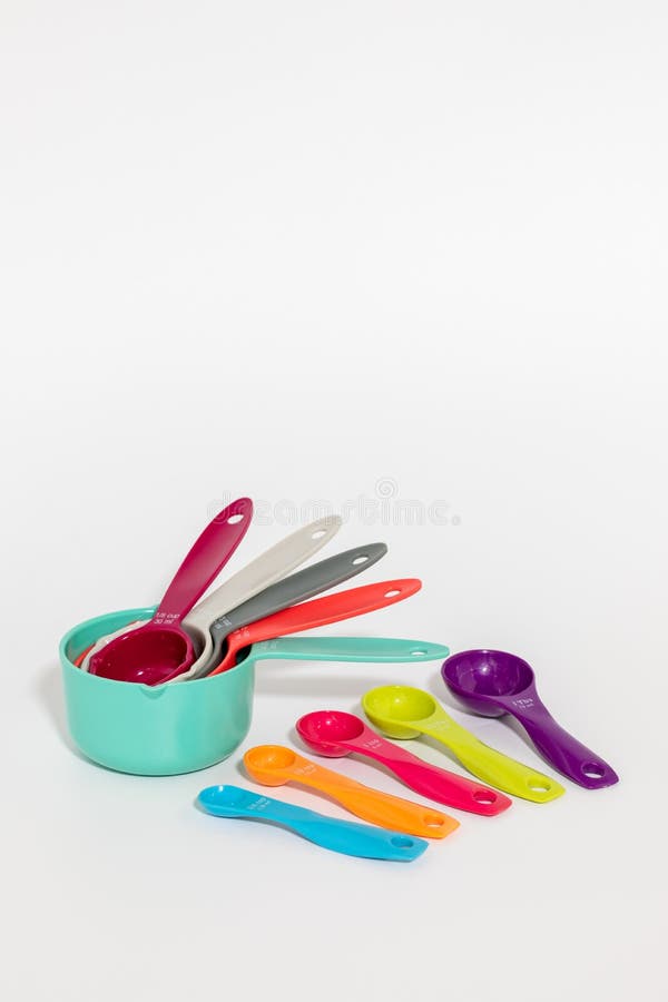 Set of measuring cups, measuring spoons, measuring glass and silicone whisk  use in cooking lay on wooden tabletop in top view 12972521 Stock Photo at  Vecteezy