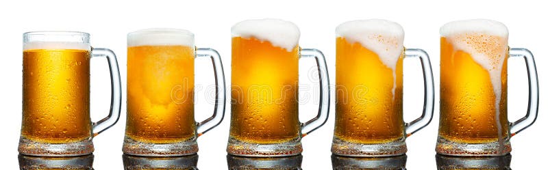 Set of mugs of cold light beer with foam isolated on white background. royalty free stock image