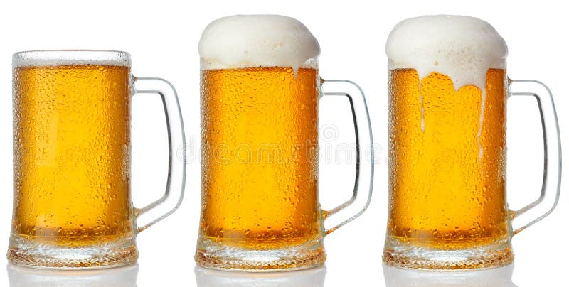 Set of mugs of cold light beer royalty free stock photo