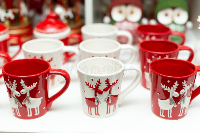 Set of mugs with deer of Christmas theme royalty free stock photos