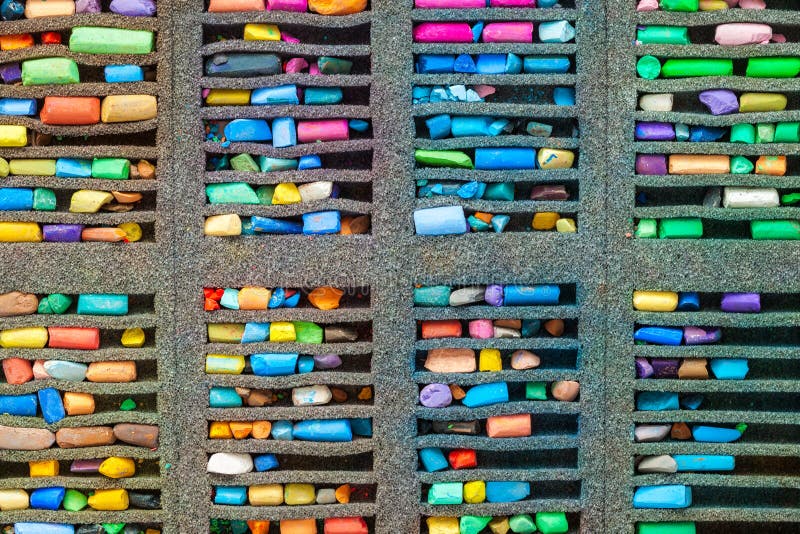 Set of multicolored pastel crayons, top view.