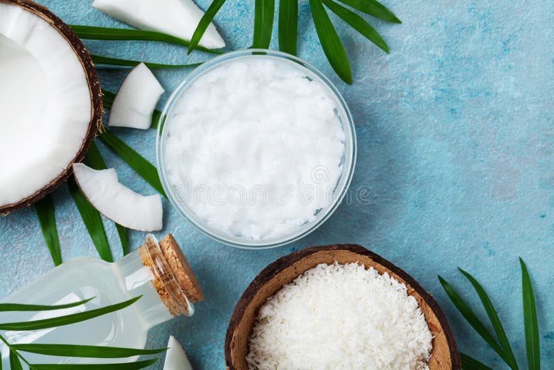 Set of organic coconut products for spa, cosmetic or food ingredients. Oil, water and shavings top view. Flat lay. stock photography Set of organic coconut products for spa, cosmetic or food ingredients. Oil, water and shavings top view. Flat lay. stock photography