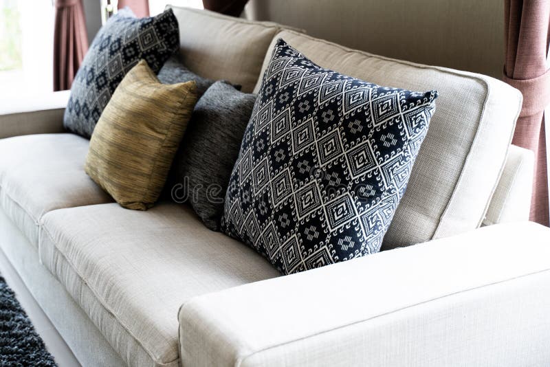 Set Pillows on white Sofa stock image. Image of light 127581235