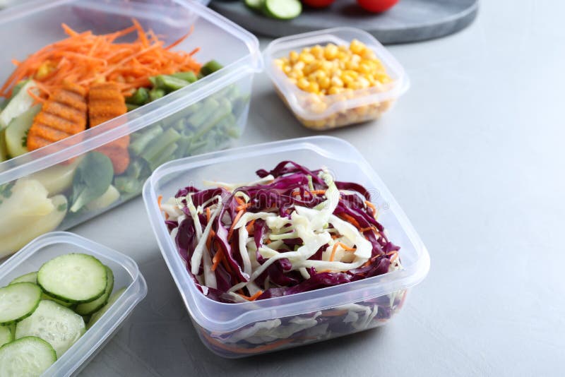 Set of Plastic Containers with Fresh Food on Light Table Stock Photo ...