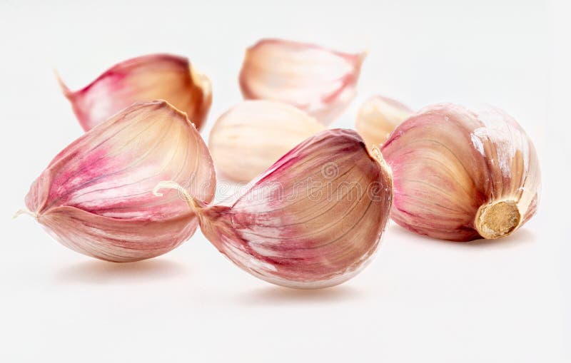 Group of Red Garlic Cloves, Black Pepper Balls and Other Spices. on a