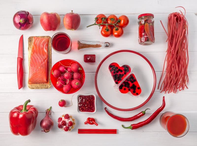 Set of red objects on white table, topview