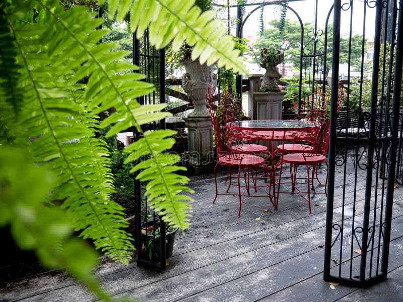 Red Table and Chairs Decorated in Cafe and Restaurant Stock Photo