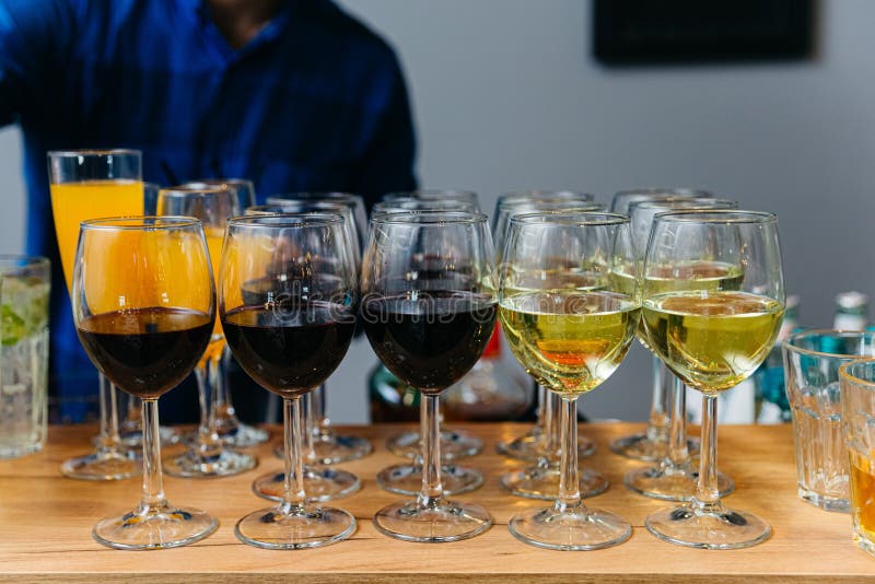 Set of Red and White Wine Served in Glasses at Bar Counter Stock Photo