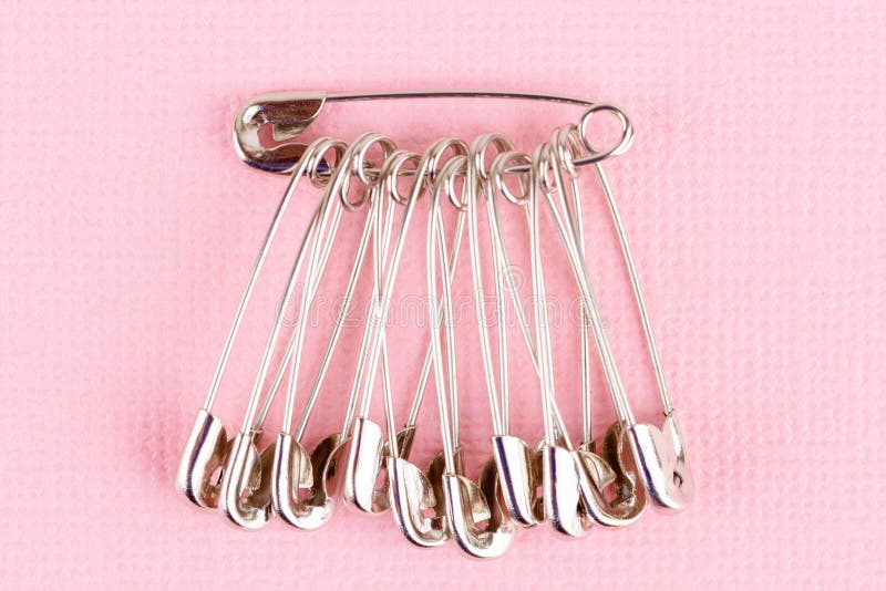 Set of Safety Pins Lying on Pink Paper Stock Photo Image of safety
