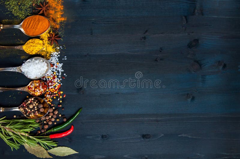 Set of seasonings and spices on wooden blue background